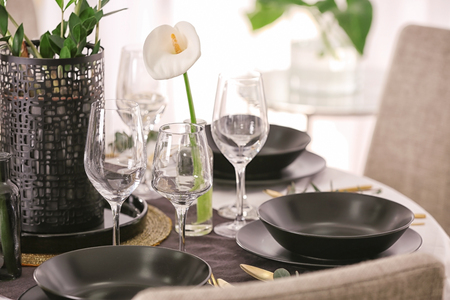 Table setting for dinner in restaurantの写真素材