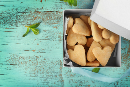 Paper box with butter cookies on wooden backgroundの写真素材