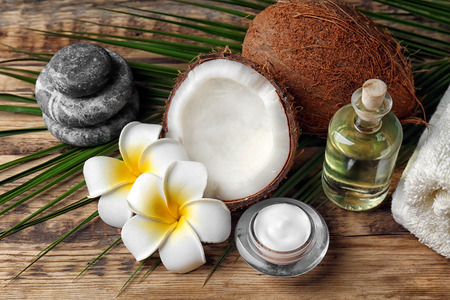 Set for spa treatment with coconut on wooden backgroundの写真素材