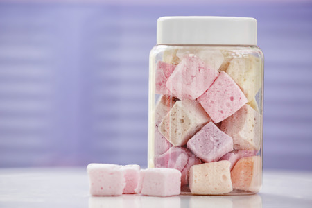 Tasty marshmallow in jar at candy shopの写真素材
