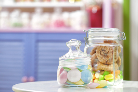 Different sweets in jars at candy shopの写真素材