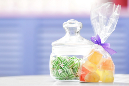 Different sweets on table at candy shopの写真素材