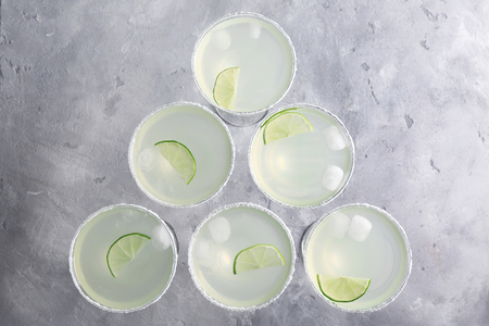 Delicious cocktail with tequila and lime on tableの写真素材