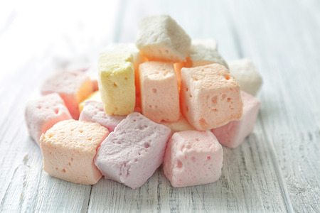 Tasty colorful marshmallows on wooden backgroundの写真素材