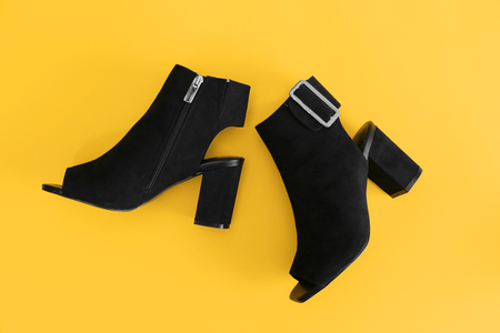 Female stylish shoes on color backgroundの写真素材