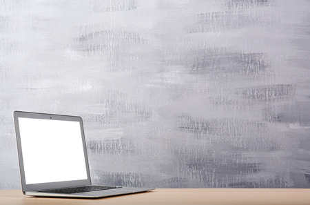 Modern laptop on color background