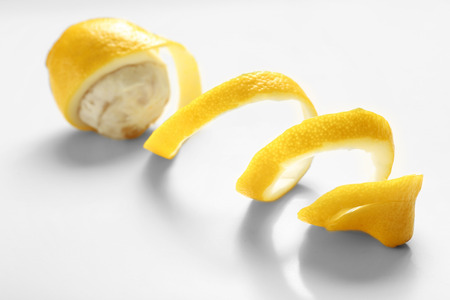 Delicious peeled lemon on white backgroundの写真素材