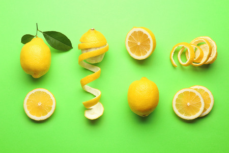 Delicious fresh lemons on color backgroundの写真素材