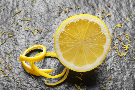Half of fresh lemon on dark backgroundの写真素材