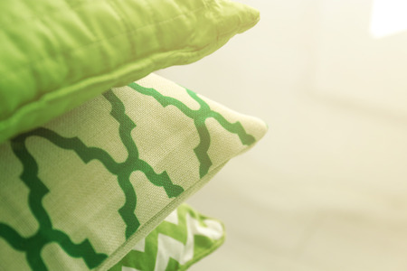 Green pillows on light blurred background, closeupの写真素材