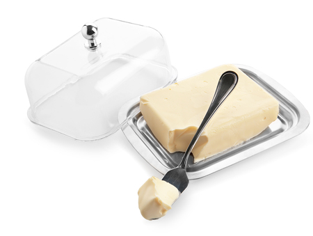 Dish with butter and shovel on white backgroundの写真素材