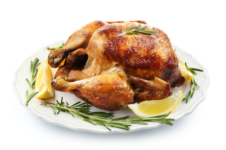 Plate with tasty homemade lemon chicken on white backgroundの写真素材