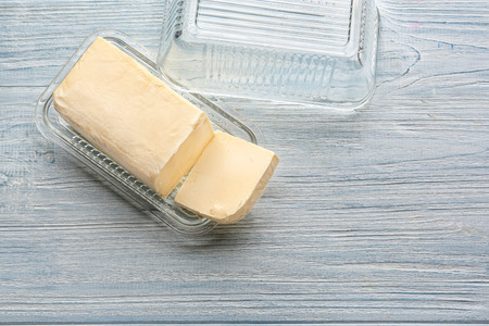 Dish with butter on wooden tableの写真素材