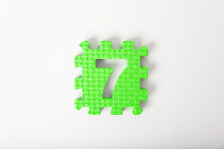 Green puzzle with number on white backgroundの写真素材