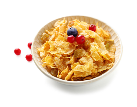 Cornflakes in bowl on white background