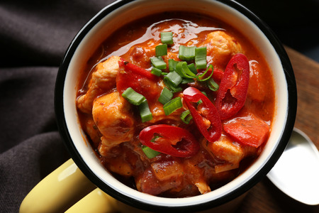 Enamel mug with delicious chili turkey, closeupの写真素材