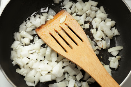 Frying pan with chopped onion, closeupの写真素材