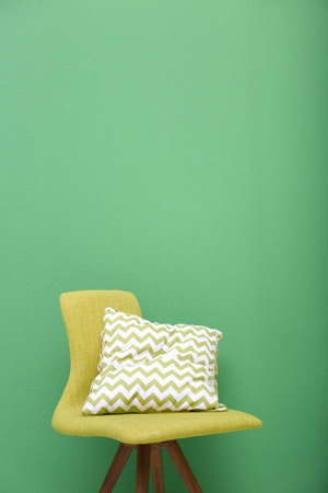 Cozy chair on green backgroundの写真素材