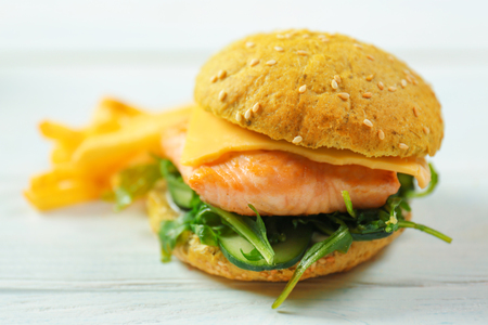 Delicious sandwich with fish on wooden tableの写真素材