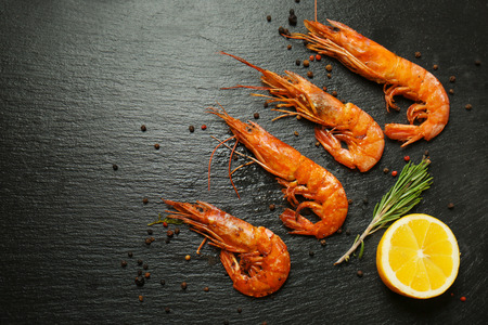 Delicious royal shrimps and lemon on tableの写真素材