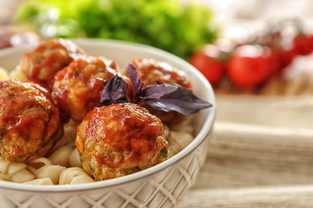 Bowl with turkey meatballs and pasta on table, closeupの写真素材