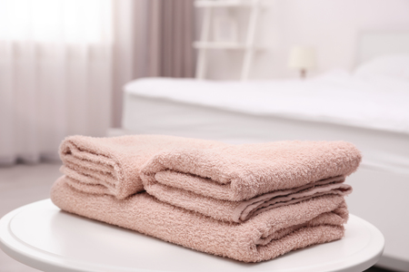 Clean towels on the table in roomの写真素材