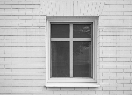 Modern plastic window of brick building