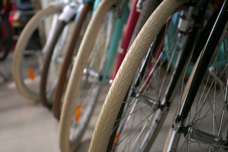 Row of new modern bicycles in shop, closeupの写真素材