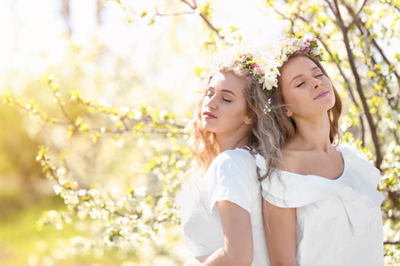 Beautiful young women outdoors on sunny dayの写真素材