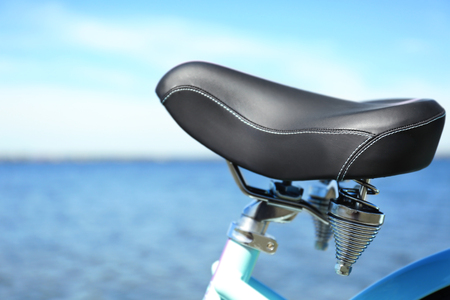 Closeup view of bicycle seat on blurred backgroundの写真素材