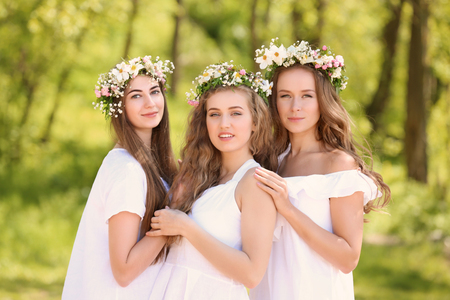 Beautiful young women outdoors on sunny dayの写真素材