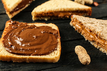 Tasty sandwiches with peanut butter on tableの写真素材