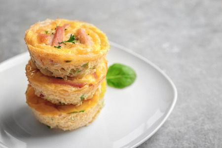 Plate with stack of tasty egg muffins on tableの写真素材