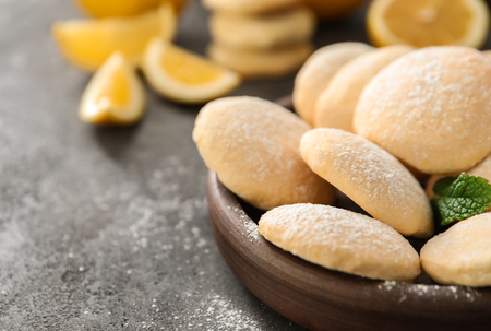 Plate with homemade lemon cookies on tableの写真素材