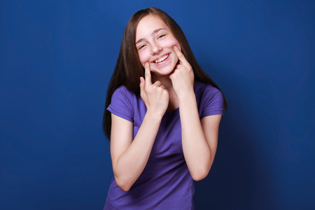 Cute pretty girl on color backgroundの写真素材
