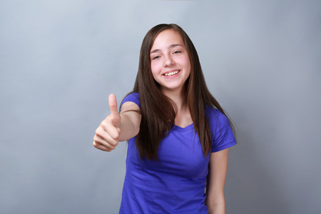 Cute pretty girl on color backgroundの写真素材