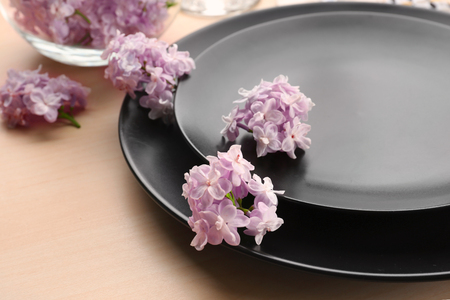 Beautiful festive table setting with lilac flower decor, closeupの写真素材