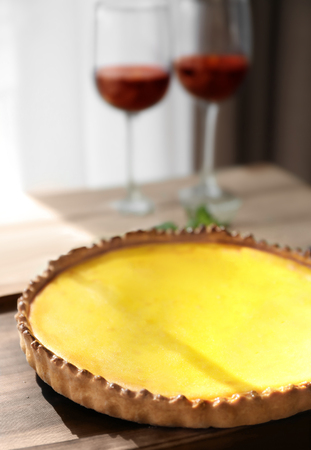 Wooden tray with tasty lemon curd pie on table, closeupの写真素材