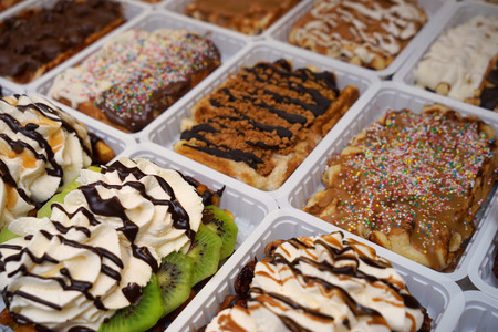 Delicious dessert with whipped cream on showcaseの写真素材