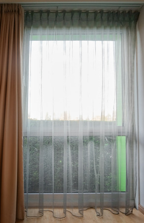 Big window and beautiful curtains indoorsの写真素材