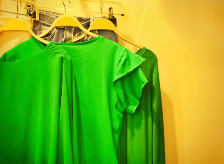 Set with green clothes on color backgroundの写真素材