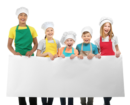 Group of children with blank poster on white background. Concept of cooking classesの写真素材