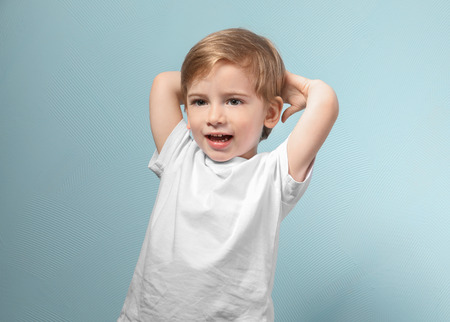 Cute little boy on color backgroundの写真素材