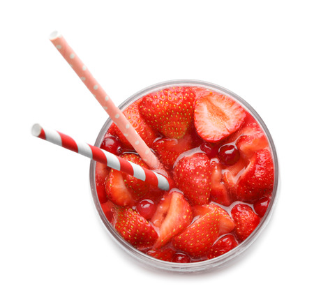 Glass of tasty strawberry lemonade on white backgroundの写真素材