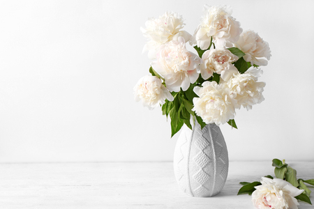 Vase with beautiful peonies on white backgroundの写真素材