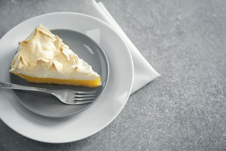 Piece of delicious lemon meringue pie on plateの写真素材