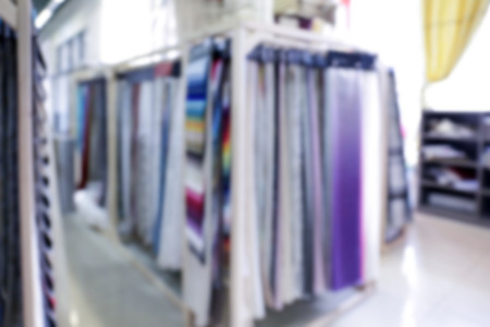 Assortment of beautiful curtain samples in shop, blurred backgroundの写真素材