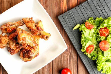 Tasty chicken in sauce on plateの写真素材