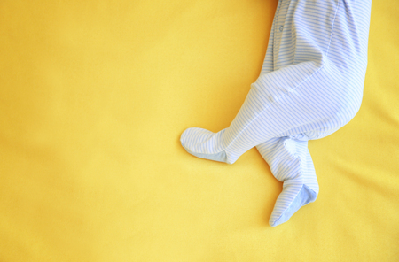 Cute little baby sleeping on bed at homeの写真素材
