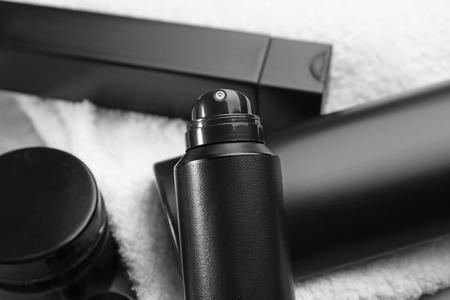 Set for personal care with deodorant on table, closeup
